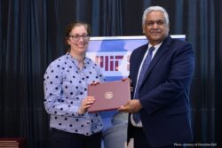 Caitlin Stier being presented with a 2025 SOE Infinite Mile Award